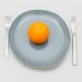 a few oranges on a plate