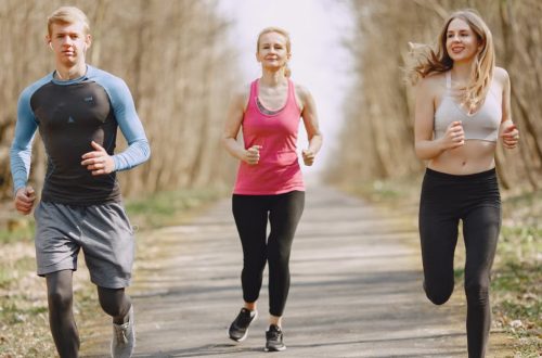 Three adults jogging on a park path, embracing a healthy and active lifestyle.